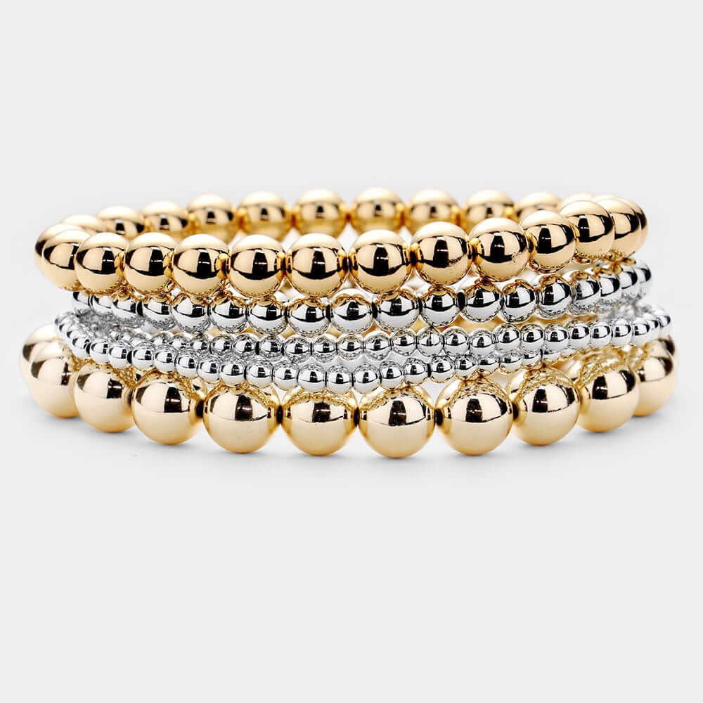 The Major Energy - Gold & Silver 5 Piece Bracelet Set features stacked stretch bracelets with alternating gold and silver beads, shown on a light gray background—an elegant choice for statement jewelry lovers.