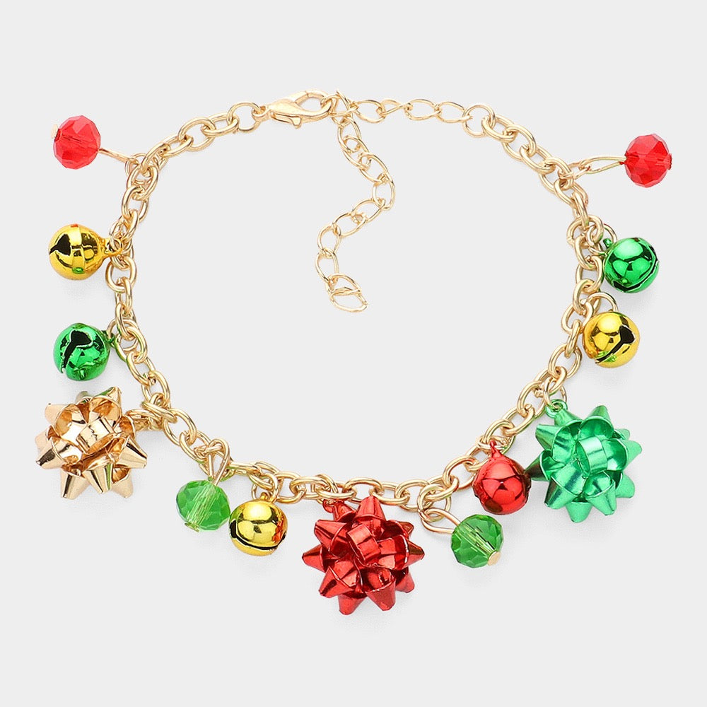 The Little Something - Multi Bracelet features gold chains adorned with shiny red, green, and gold gift bows, jingle bells, and faceted holiday beads—perfect for adding festive cheer to any jewelry collection.
