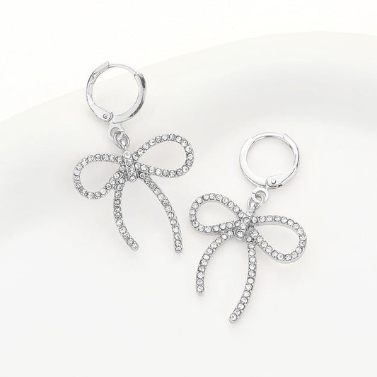 Glow & Grace - Silver Stone Paved Bow Dangle Huggie Earrings-Shop Alies Boutique